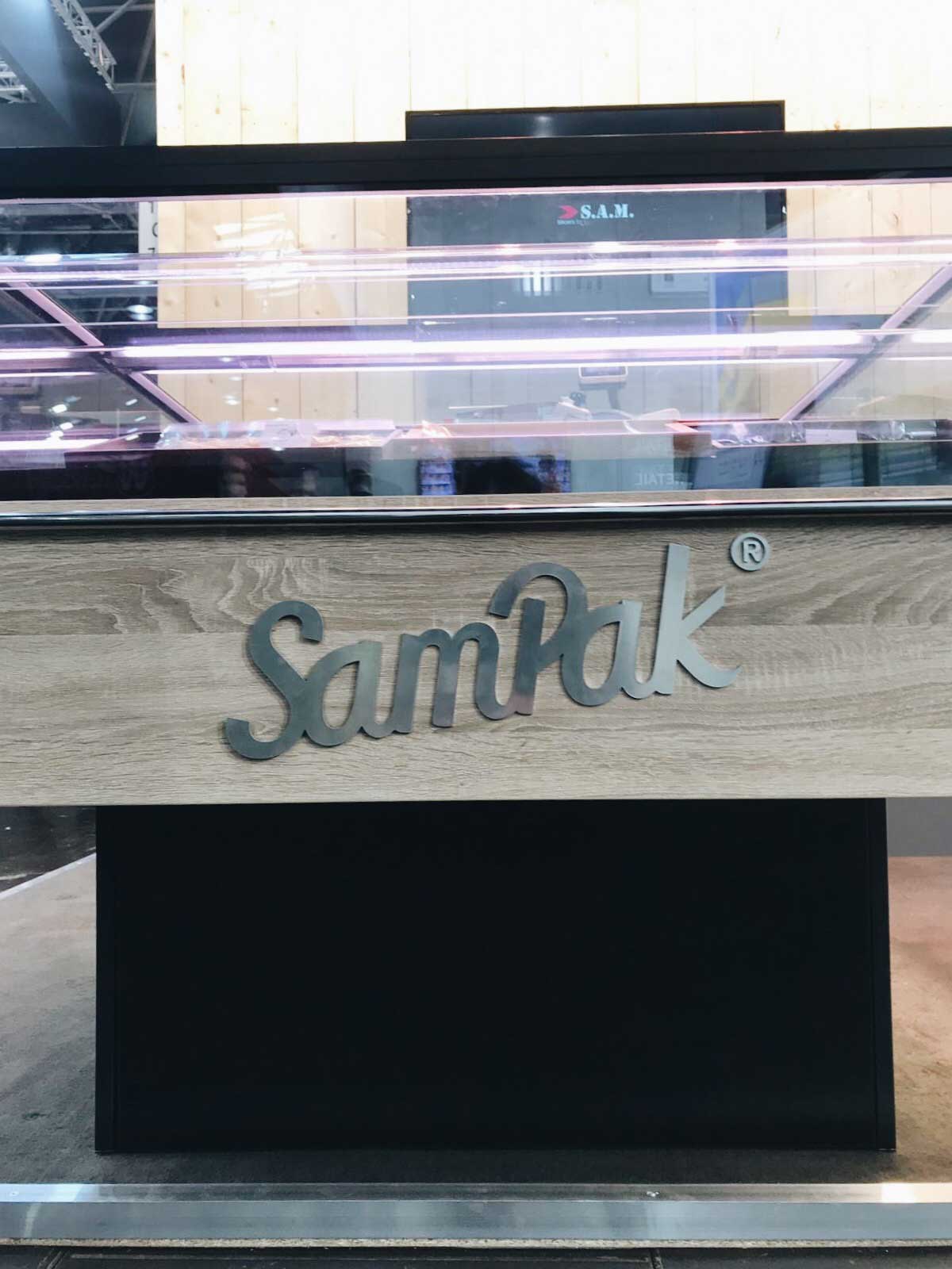 sam kuchler eurocis messestand, sampak logo